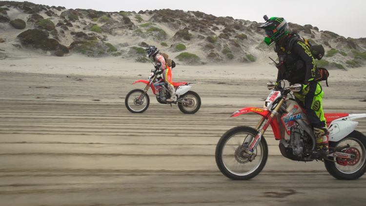 Cameron Steele and Derek Newell cruising down the beach.
