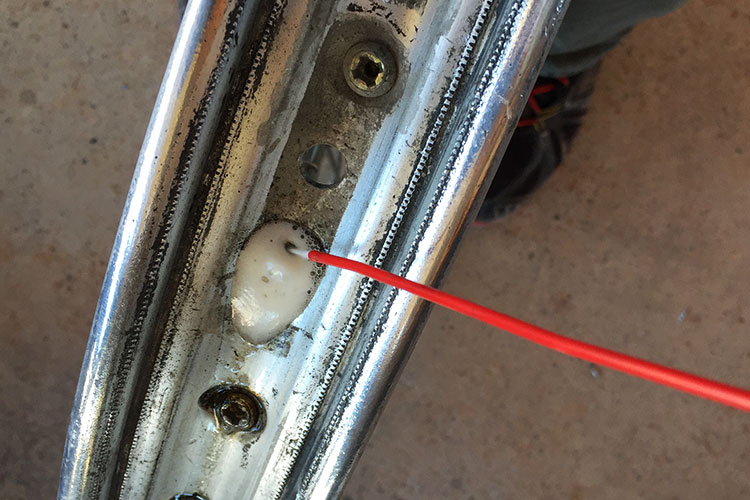 Plan ahead and use some lube on the spoke nipples. We like a penetrating oil like PB Blaster or Liquid Wrench to help break lose the spokes. Especially on aluminum nipples as they tend to corrode. Squirt a little bit on both sides of the nipples and let it sit overnight. This will really help. 