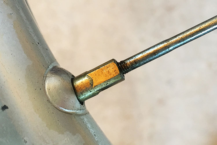 When loosening the spokes take some time to note the distance that the spoke goes into the nipple. You can do this by counting how many turns the nipple takes to come off or even by visually seeing how deep it goes into the nipple from inside the rim.