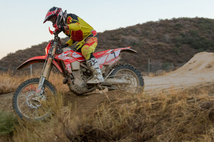 Robert coming off the Supercross track one final time before installing the KC HiLites. 